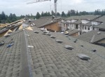 New Roof Construction on Cedar Downs Condominiums in Pitt Meadows, BC: Sloped Roofing & Skylights